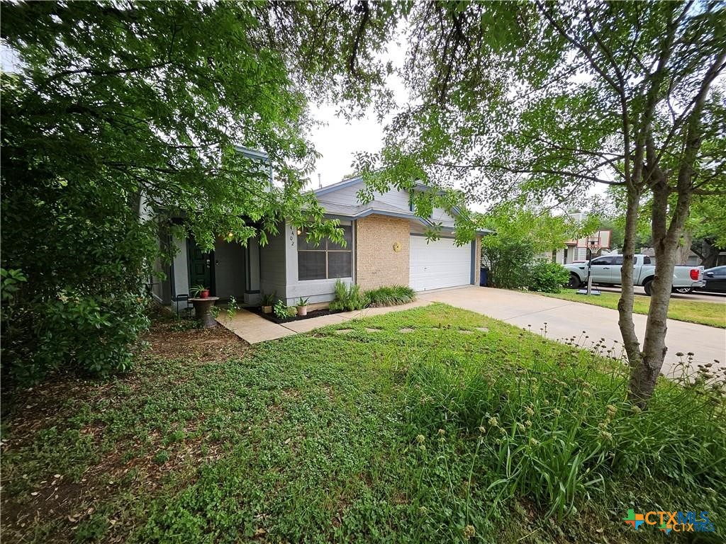 4402 Keota Drive Austin, TX 78749 - Photo 13 of 37 a house view with a garden space
