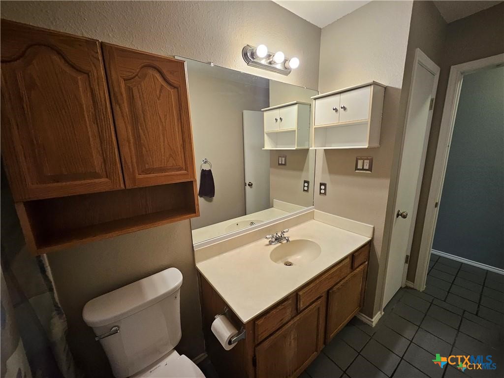 4402 Keota Drive Austin, TX 78749 - Photo 26 of 37 a bathroom with a sink toilet and shower