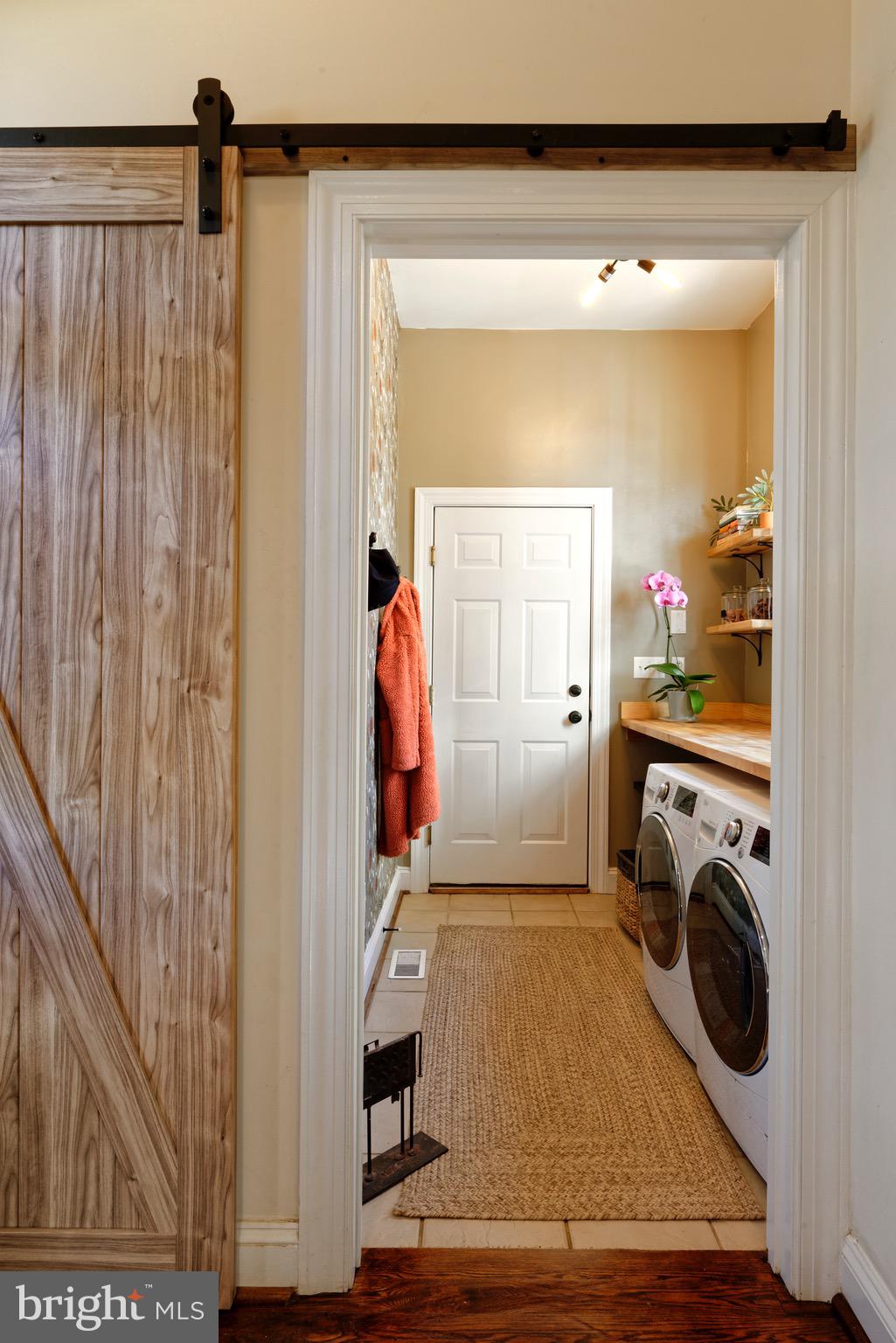 23154 Dover Road Middleburg, VA 20117 - Photo 24 of 66 Barn door slides to reveal the laundry/mudroom