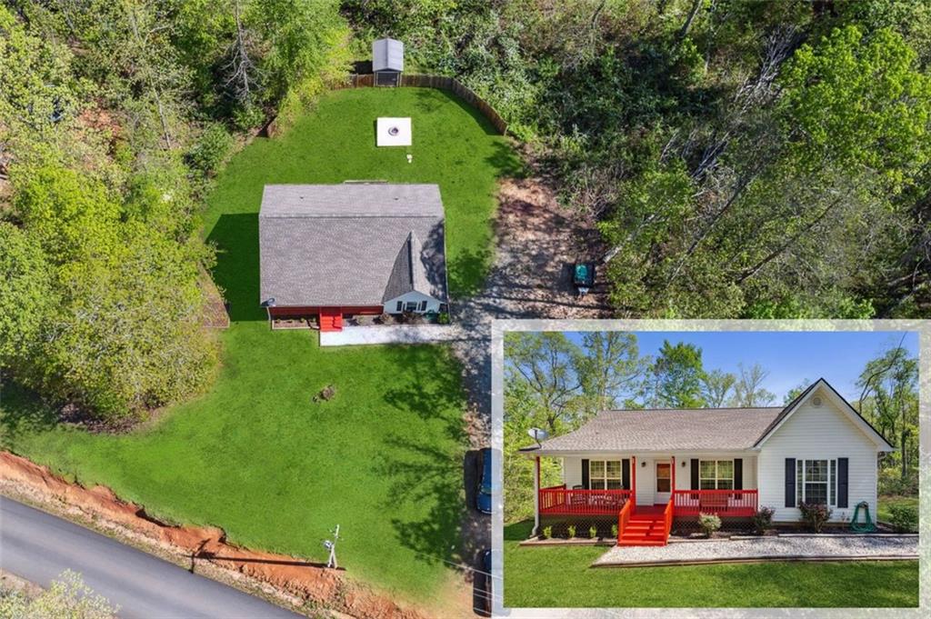 a view of house with garden and tall trees