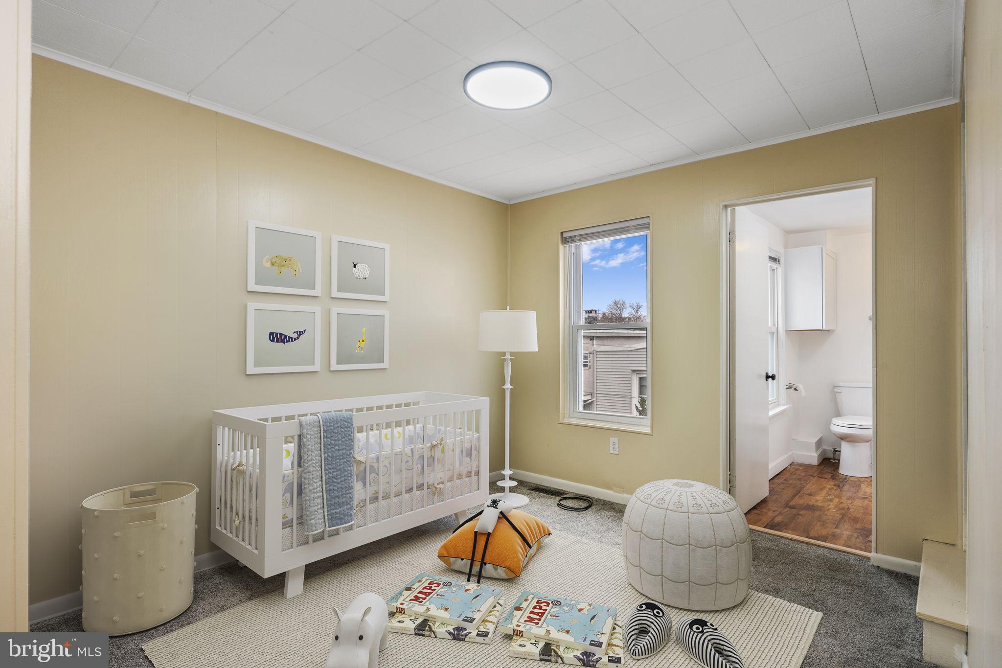 207 Kline Street Reading, PA 19611 - Photo 13 of 24 a bedroom with a bed and wooden floor