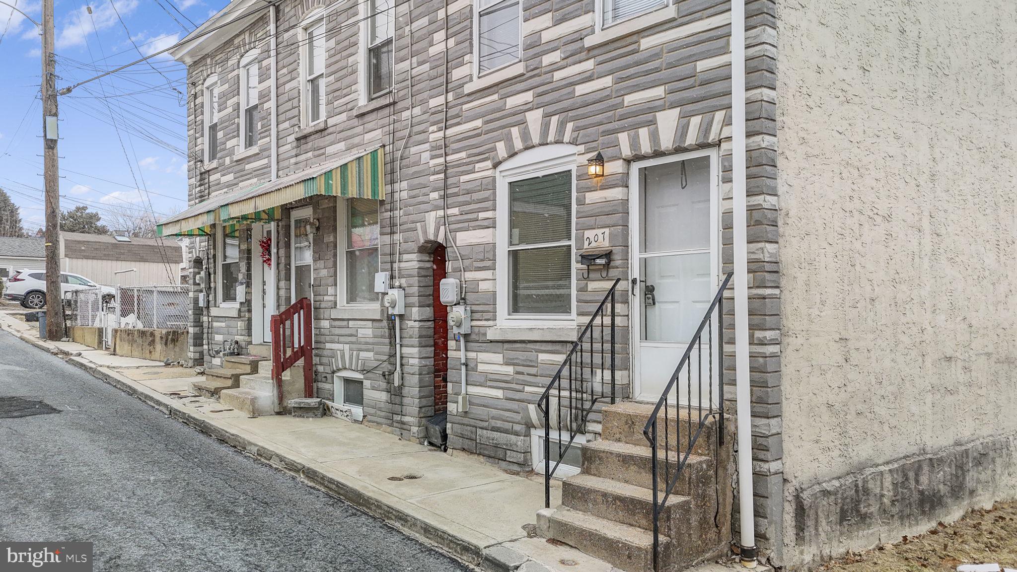 207 Kline Street Reading, PA 19611 - Photo 23 of 24 a view of a brick building with many windows