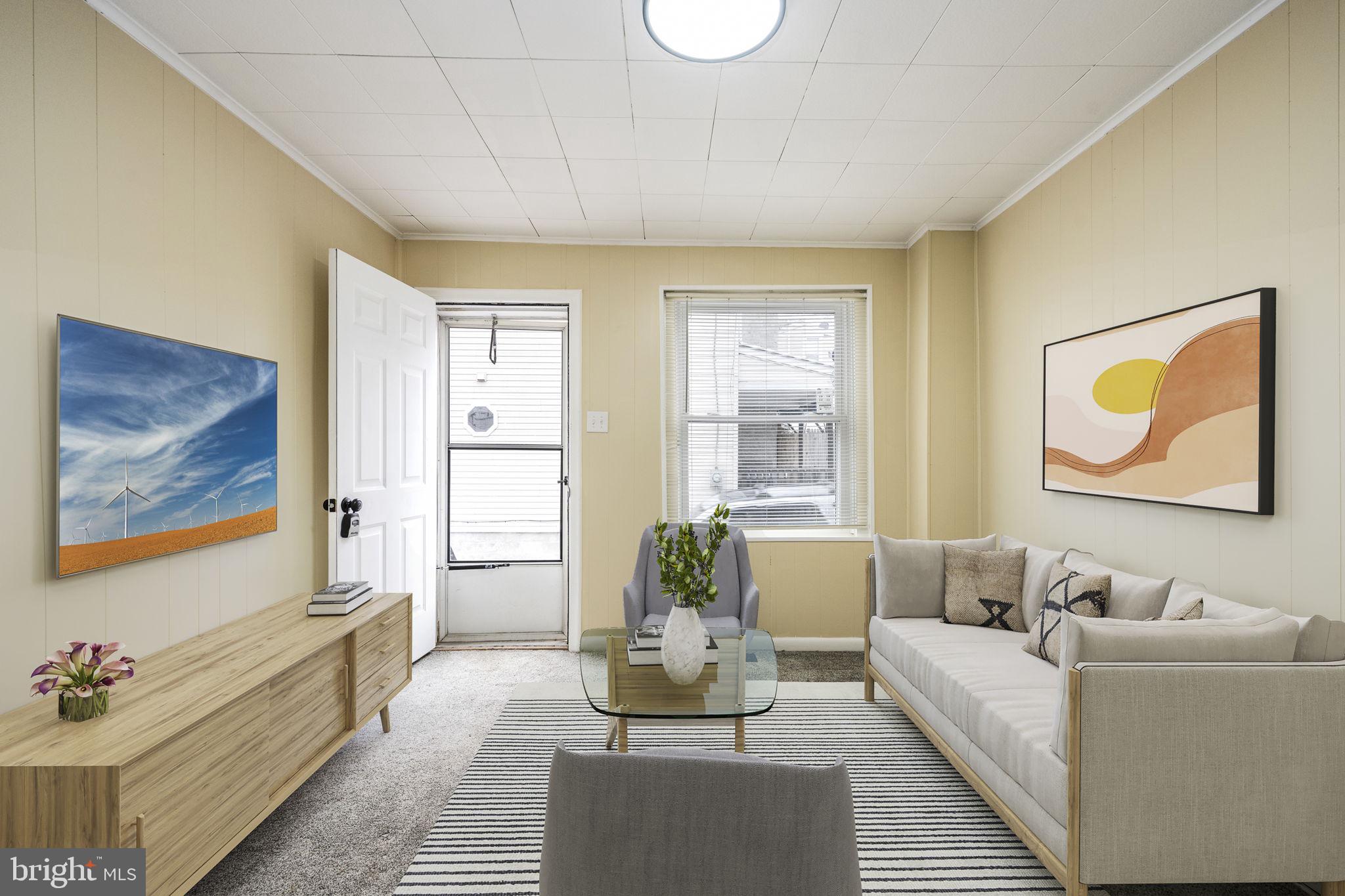207 Kline Street Reading, PA 19611 - Photo 3 of 24 a living room with furniture and a painting on the wall