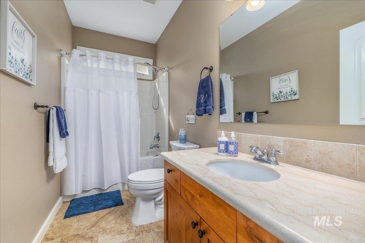 3038 North Christian Way Meridian, ID 83646 - Photo 20 of 48 Full bath featuring shower / bath combo with shower curtain and vanity