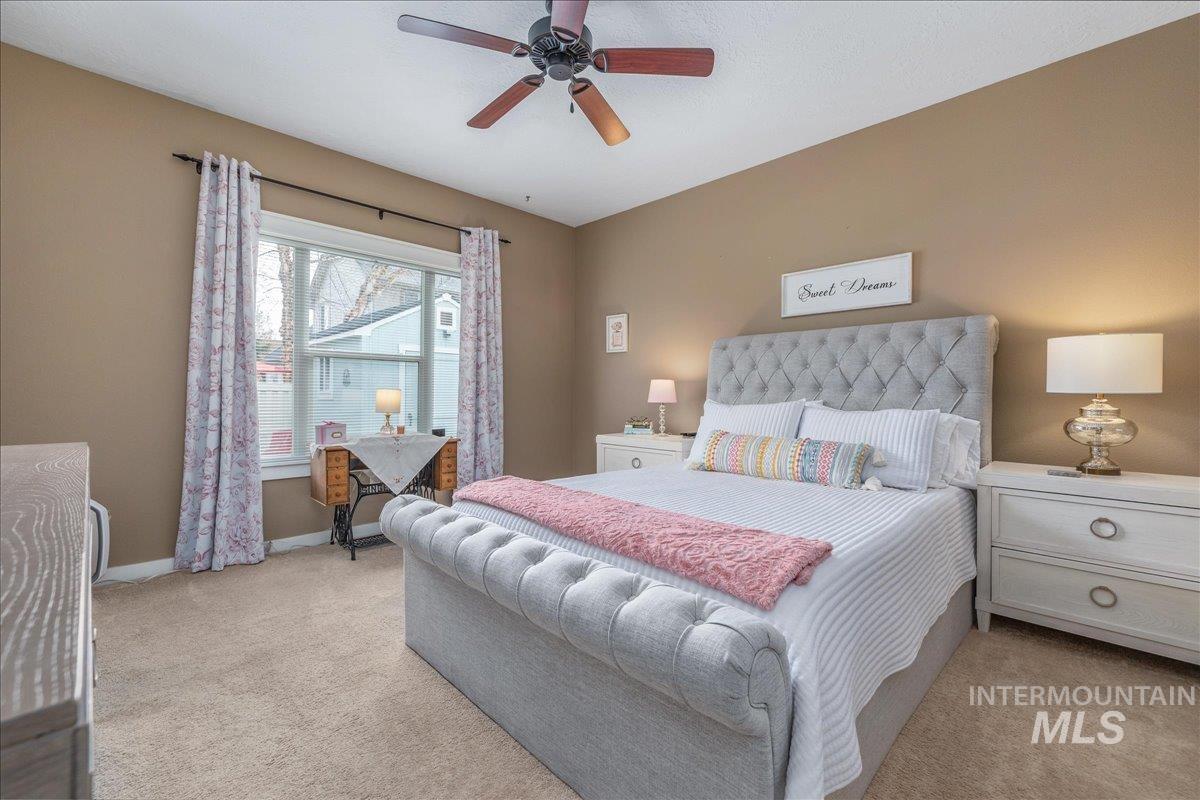 3038 North Christian Way Meridian, ID 83646 - Photo 23 of 48 Bedroom with light colored carpet and a ceiling fan