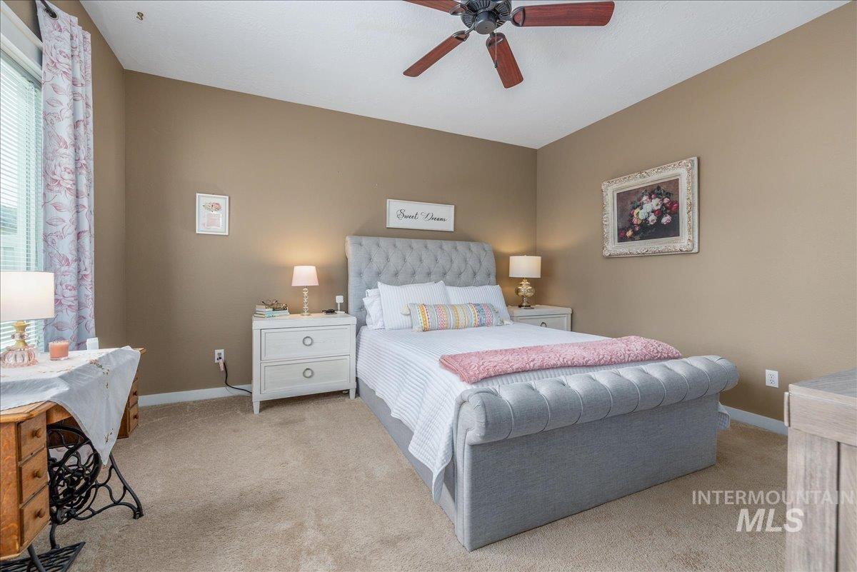 3038 North Christian Way Meridian, ID 83646 - Photo 24 of 48 Bedroom featuring light carpet and a ceiling fan