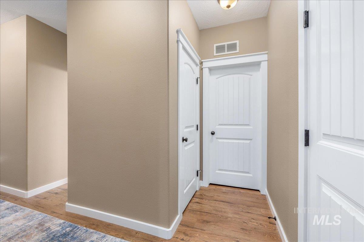 3038 North Christian Way Meridian, ID 83646 - Photo 31 of 48 Hall with light wood-style floors and baseboards