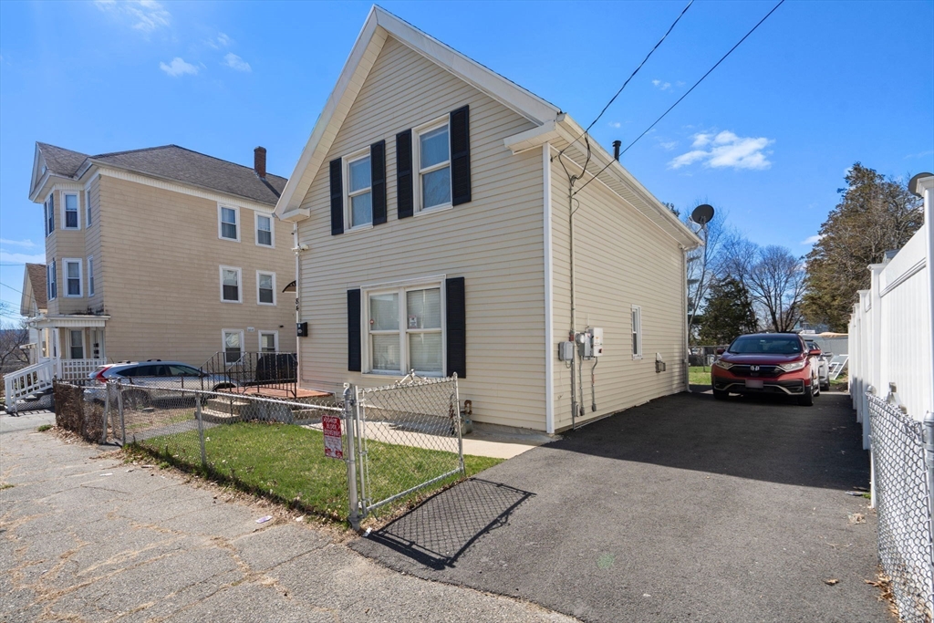 84 Howard Street Lawrence, MA 01841 - Photo 2 of 28 a view of a house with backyard and sitting area