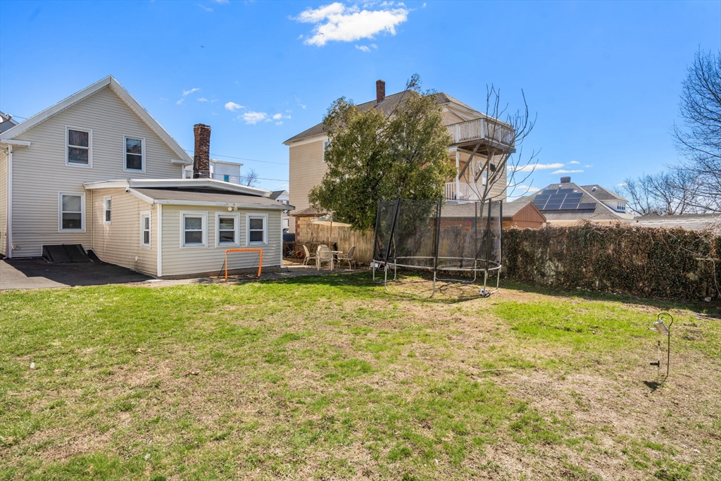 84 Howard Street Lawrence, MA 01841 - Photo 28 of 28 a view of a house with a backyard