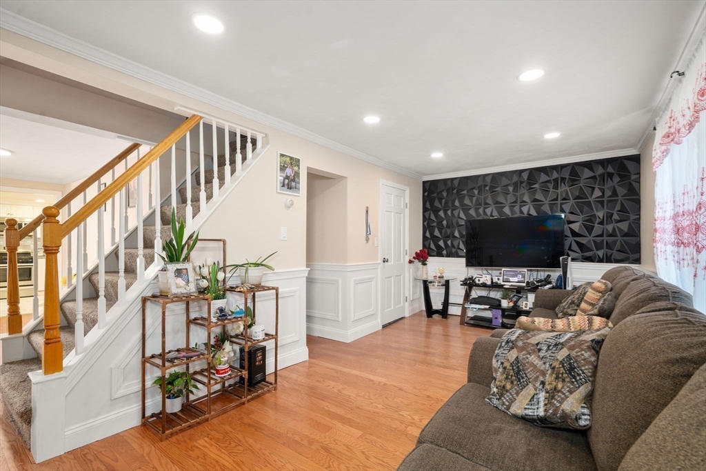 84 Howard Street Lawrence, MA 01841 - Photo 7 of 28 a living room with furniture and a flat screen tv