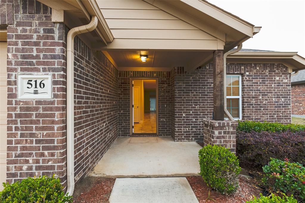 Brick exterior with a covered entry