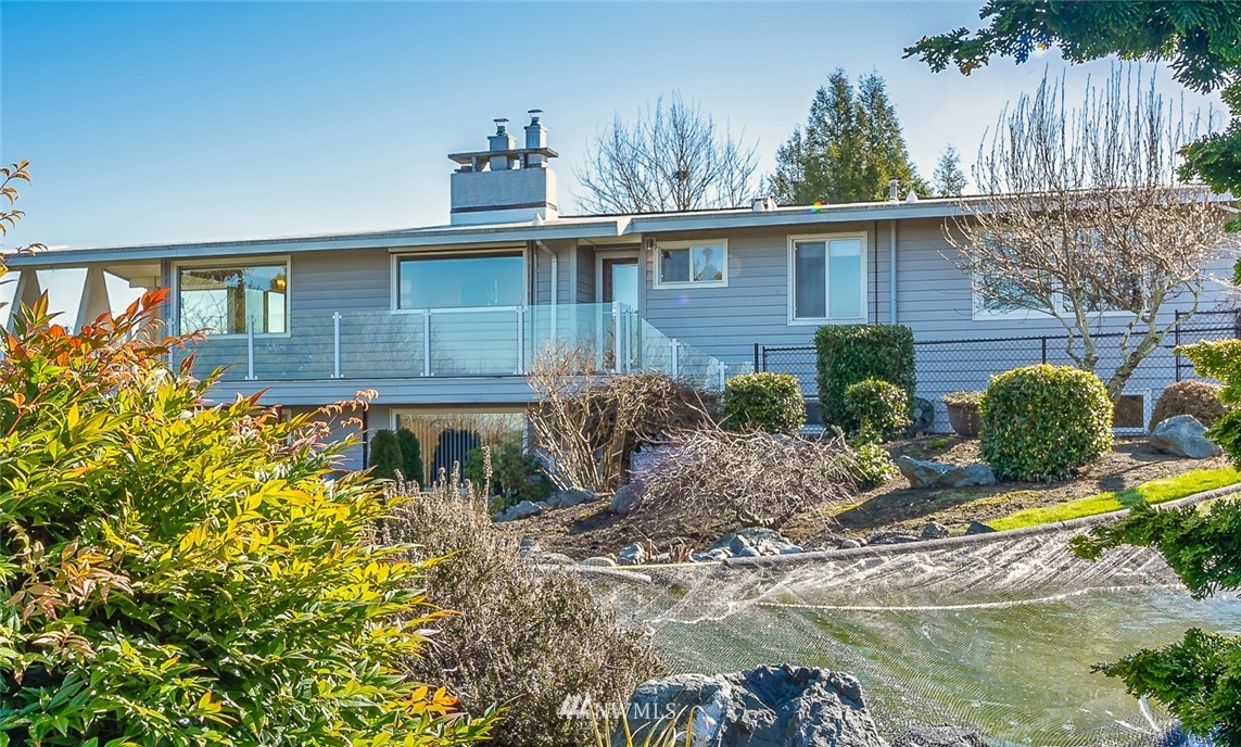 5874 Laurel Ridge Way Bellingham, WA 98226 - Photo 1 of 40 a view of a house with backyard and sitting area