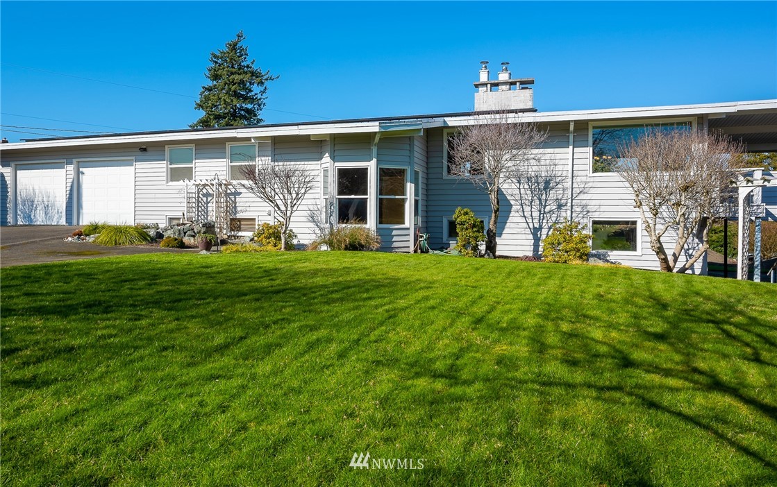 5874 Laurel Ridge Way Bellingham, WA 98226 - Photo 2 of 40 a front view of a house with a yard