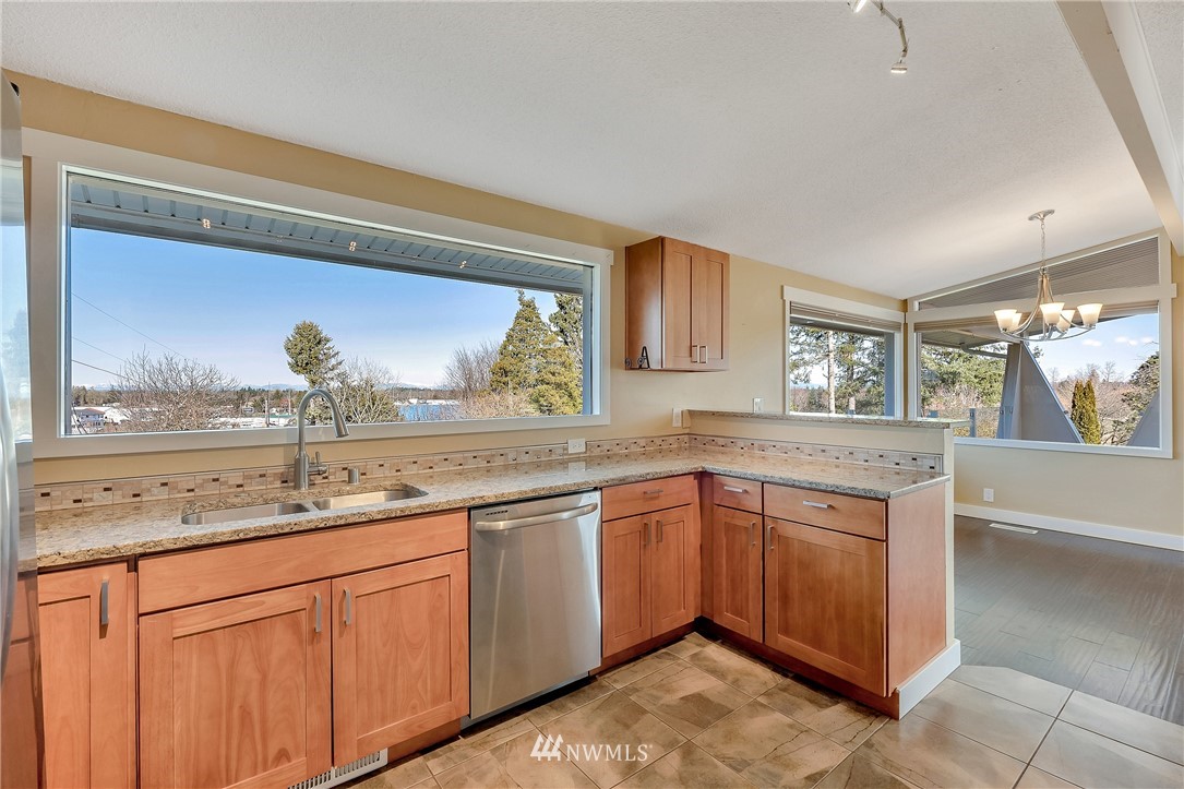 5874 Laurel Ridge Way Bellingham, WA 98226 - Photo 14 of 40 a kitchen with a sink and cabinets