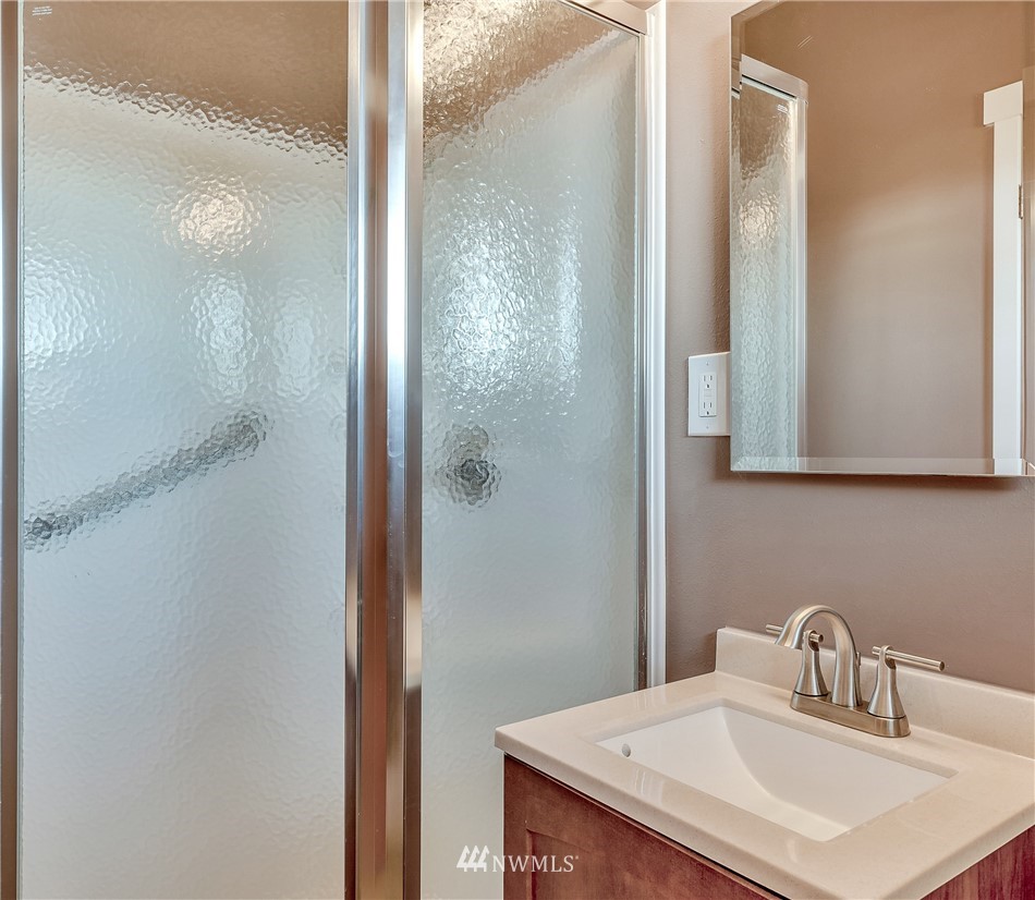 5874 Laurel Ridge Way Bellingham, WA 98226 - Photo 17 of 40 a bathroom with a sink and a mirror