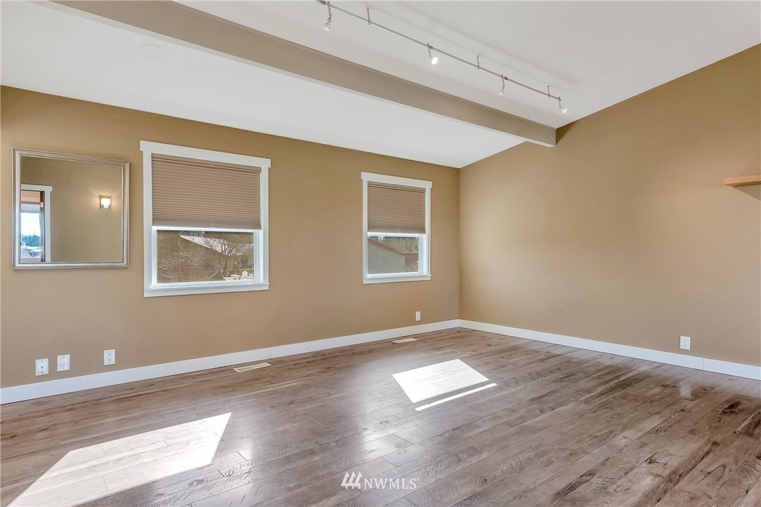 5874 Laurel Ridge Way Bellingham, WA 98226 - Photo 18 of 40 a view of empty room with wooden floor and fan