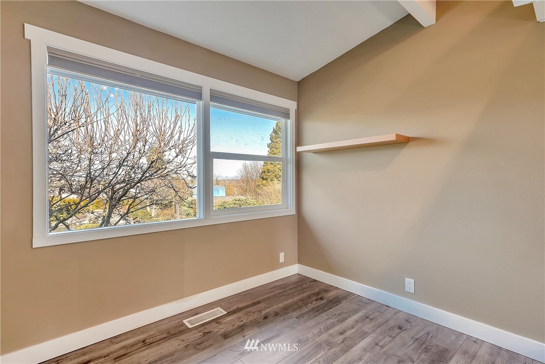 5874 Laurel Ridge Way Bellingham, WA 98226 - Photo 20 of 40 a view of an empty room with a window and wooden floor