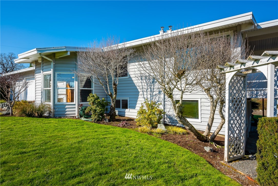 5874 Laurel Ridge Way Bellingham, WA 98226 - Photo 3 of 40 a view of a house with backyard porch and sitting area