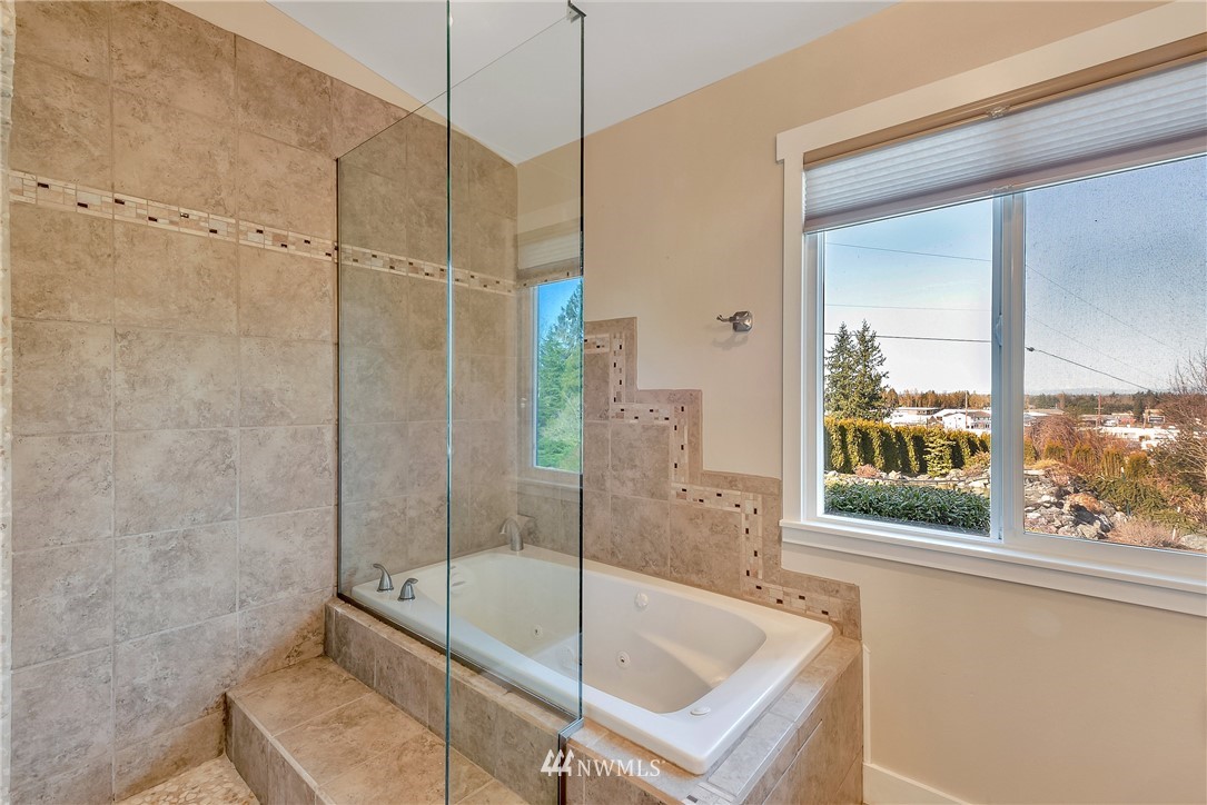 5874 Laurel Ridge Way Bellingham, WA 98226 - Photo 23 of 40 a bathroom with a tub and a shower