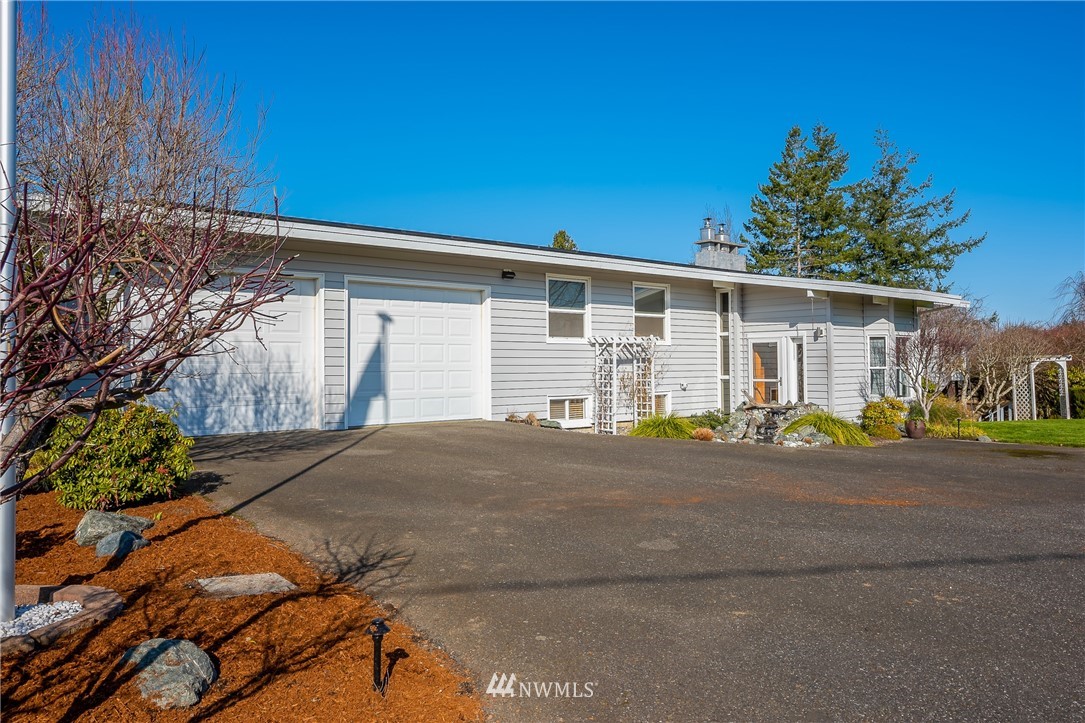 5874 Laurel Ridge Way Bellingham, WA 98226 - Photo 37 of 40 a front view of a house with a yard and garage