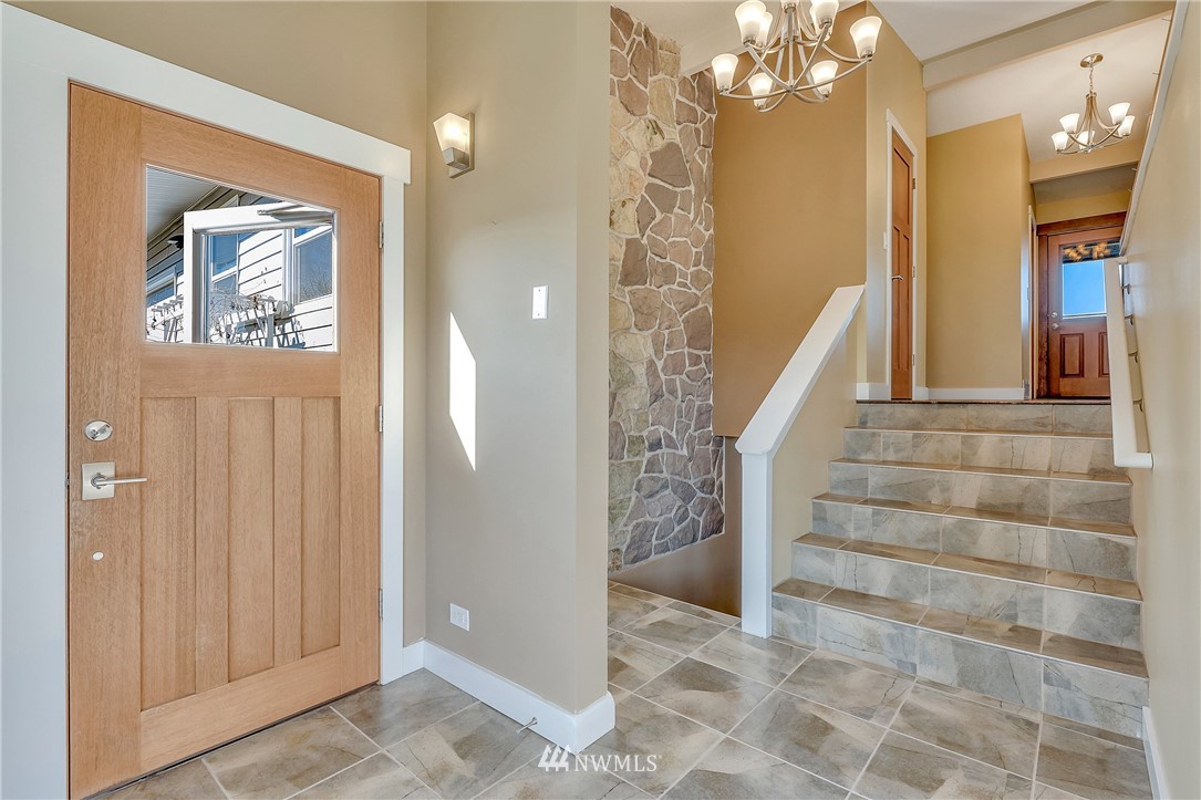 5874 Laurel Ridge Way Bellingham, WA 98226 - Photo 6 of 40 a view of a hallway with paintings on the walls