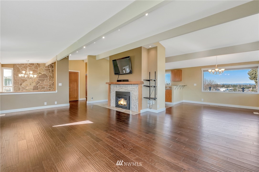 5874 Laurel Ridge Way Bellingham, WA 98226 - Photo 10 of 40 a view of an empty room with wooden floor and a window