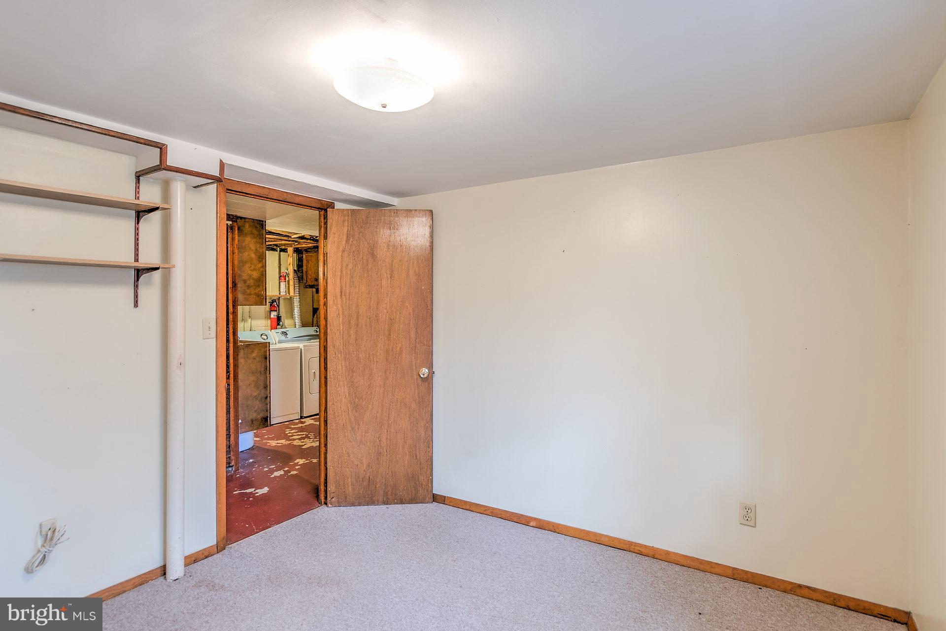 5974 Hillside Road St. Leonard, MD 20685 - Photo 18 of 28 one of two lower level bedrooms.