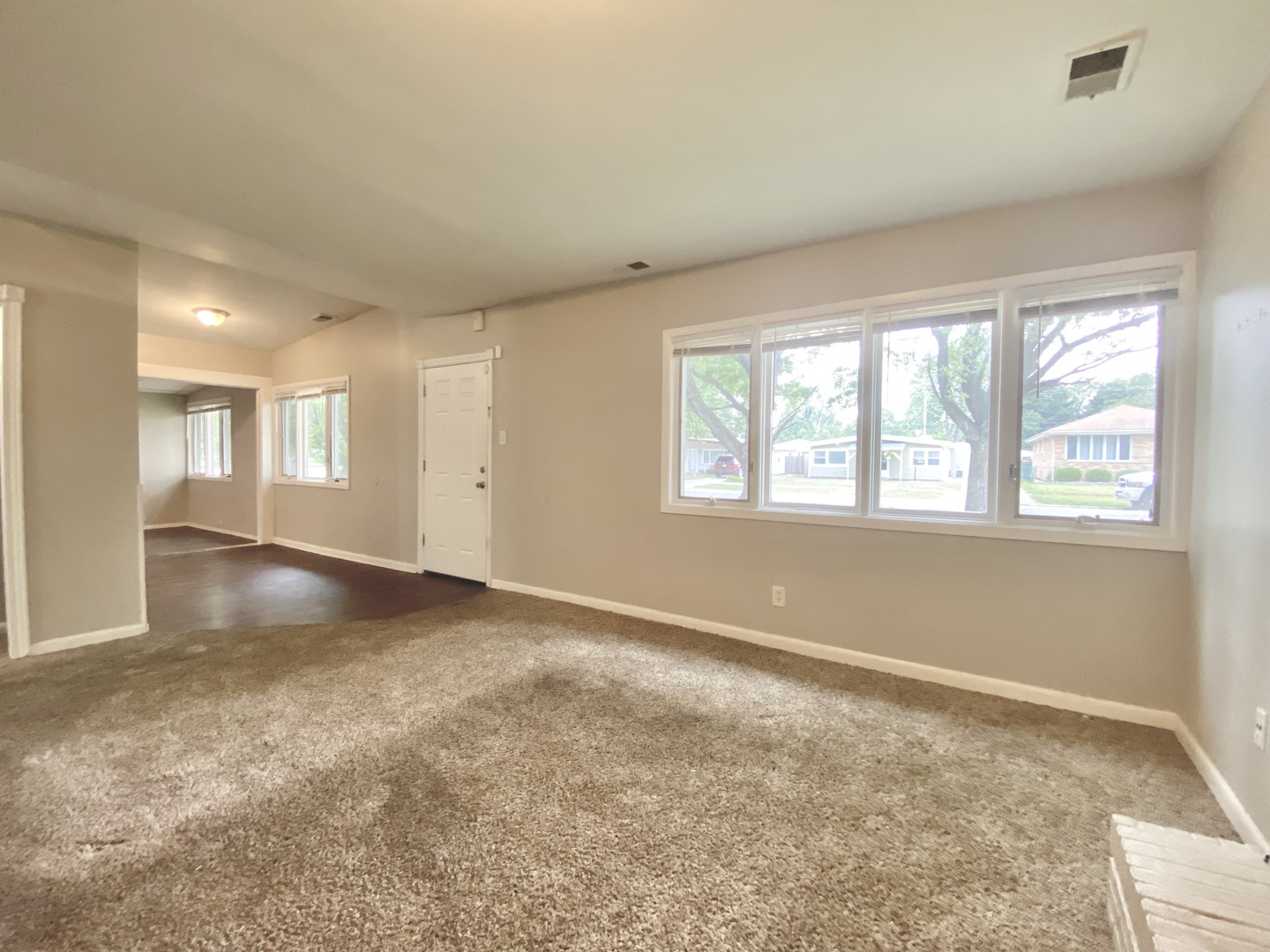 18747 Sherman Street Lansing, IL 60438 - Photo 5 of 20 a view of an empty room with a window