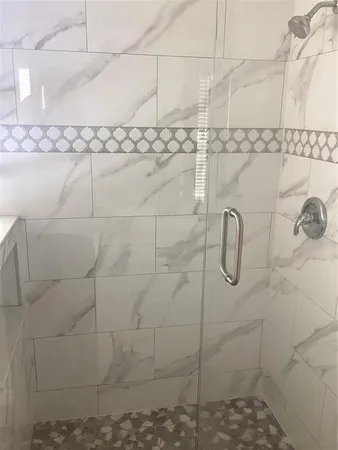a bathroom with a shower and a toilet