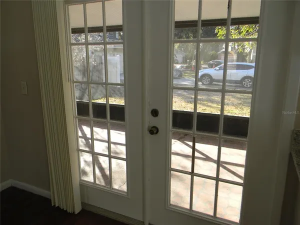 a view of balcony with floor to ceiling window and outdoor view