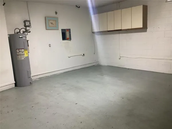 a large kitchen with stainless steel appliances granite countertop a stove a sink dishwasher and a microwave