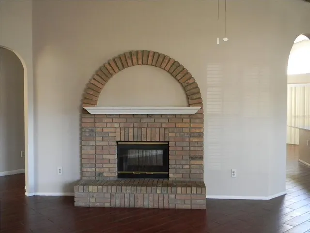 a stone house with a fireplace in it