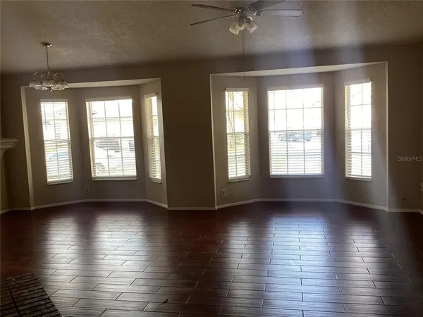 a kitchen with a refrigerator a stove a microwave and cabinets
