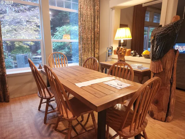 a view of a dining table and chairs in the patio