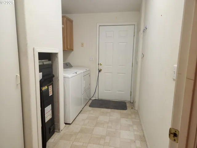 a view of a hallway with bathroom and a closet
