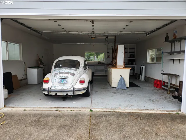 a view of a backyard with plants and patio
