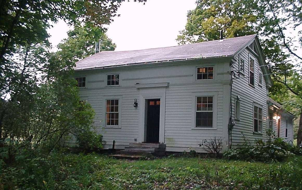 1050 W Road Richmond, MA 01254 - Photo 2 of 11 a front view of a house with a garden