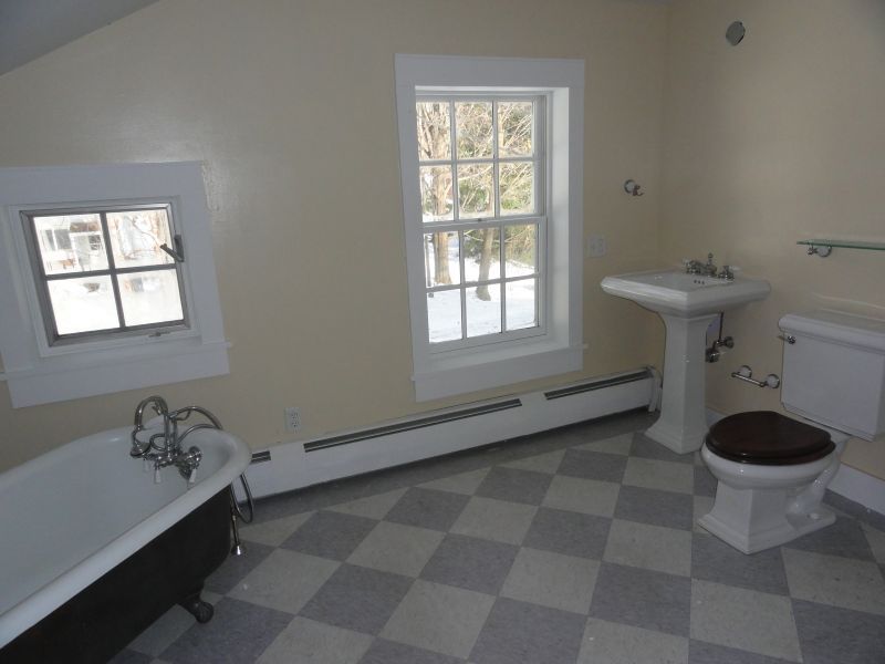 1050 W Road Richmond, MA 01254 - Photo 4 of 11 a bathroom with a sink a toilet and a window