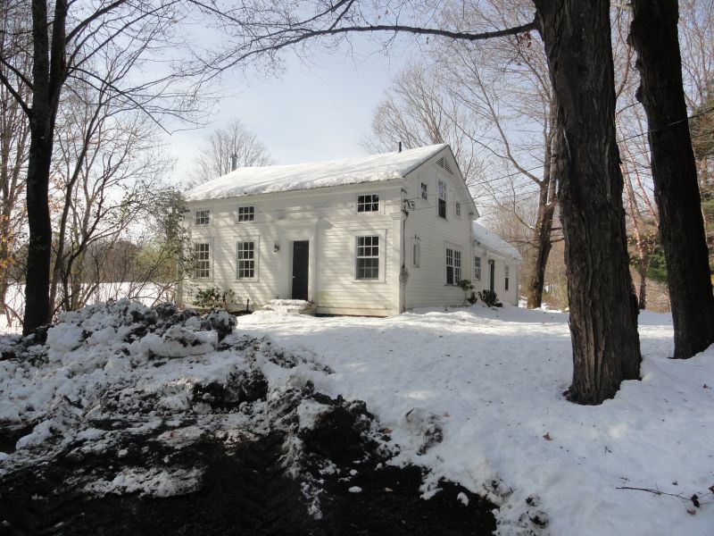 1050 W Road Richmond, MA 01254 - Photo 7 of 11 a view of a house with a snow in the yard