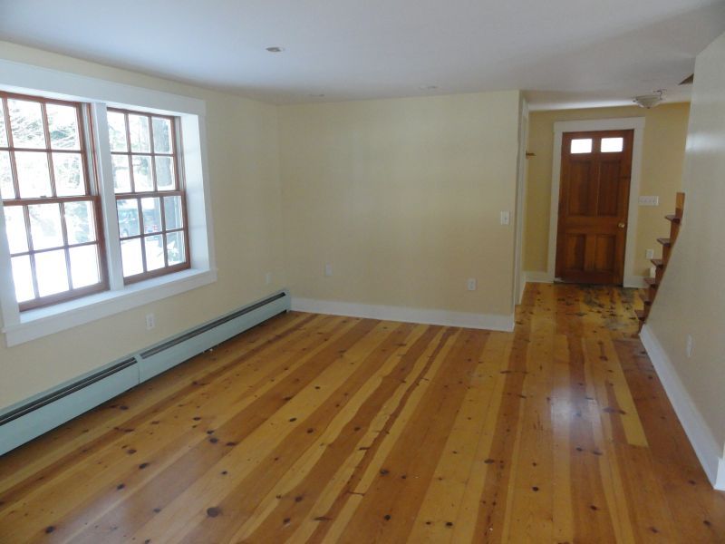 1050 W Road Richmond, MA 01254 - Photo 9 of 11 an empty room with wooden floor and windows