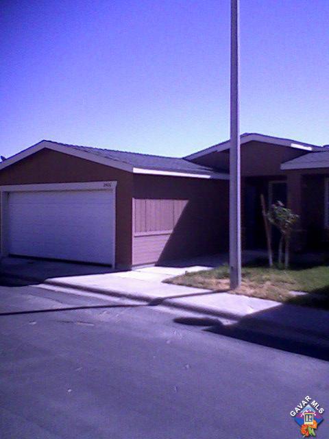 2406 Summit View Drive Rosamond, CA 93560 - Photo 2 of 3 a house with trees in the background