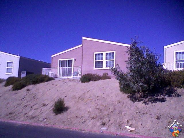 2406 Summit View Drive Rosamond, CA 93560 - Photo 3 of 3 a front view of a house with a yard
