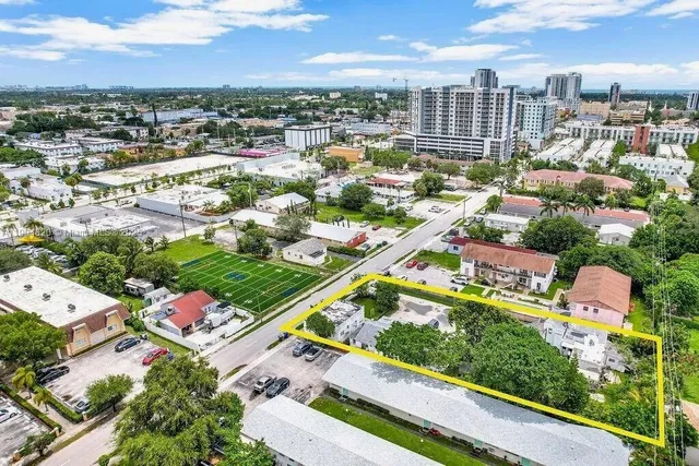 an aerial view of residential houses with city street view