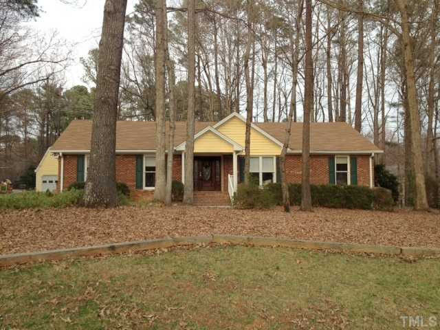 8812 Trailing Cedar Drive Raleigh, NC 27613 - Photo 1 of 25 Wonderful all brick home with cedar siding accents nesled on a large wooded lot in the desirable Springdale Estates Subdivision... come see what all the buzz is about! Exterior Front
