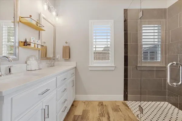 a bathroom with a sink and a shower
