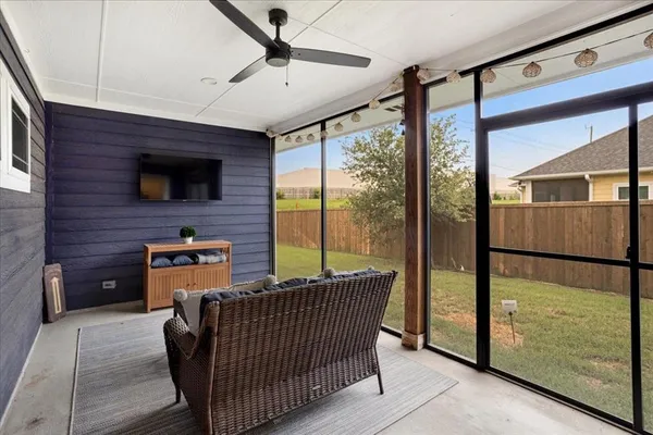 a balcony view with a flat screen tv