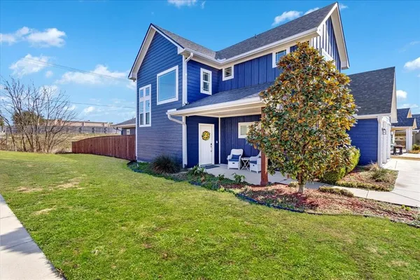a view of a house with a yard