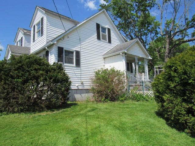 1052 North Eighty Eight Road Rices Landing, PA 15357 - Photo 2 of 24 a front view of a house with a garden