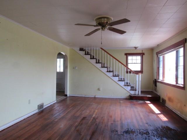 1052 North Eighty Eight Road Rices Landing, PA 15357 - Photo 9 of 24 a view of empty room with wooden floor and fan