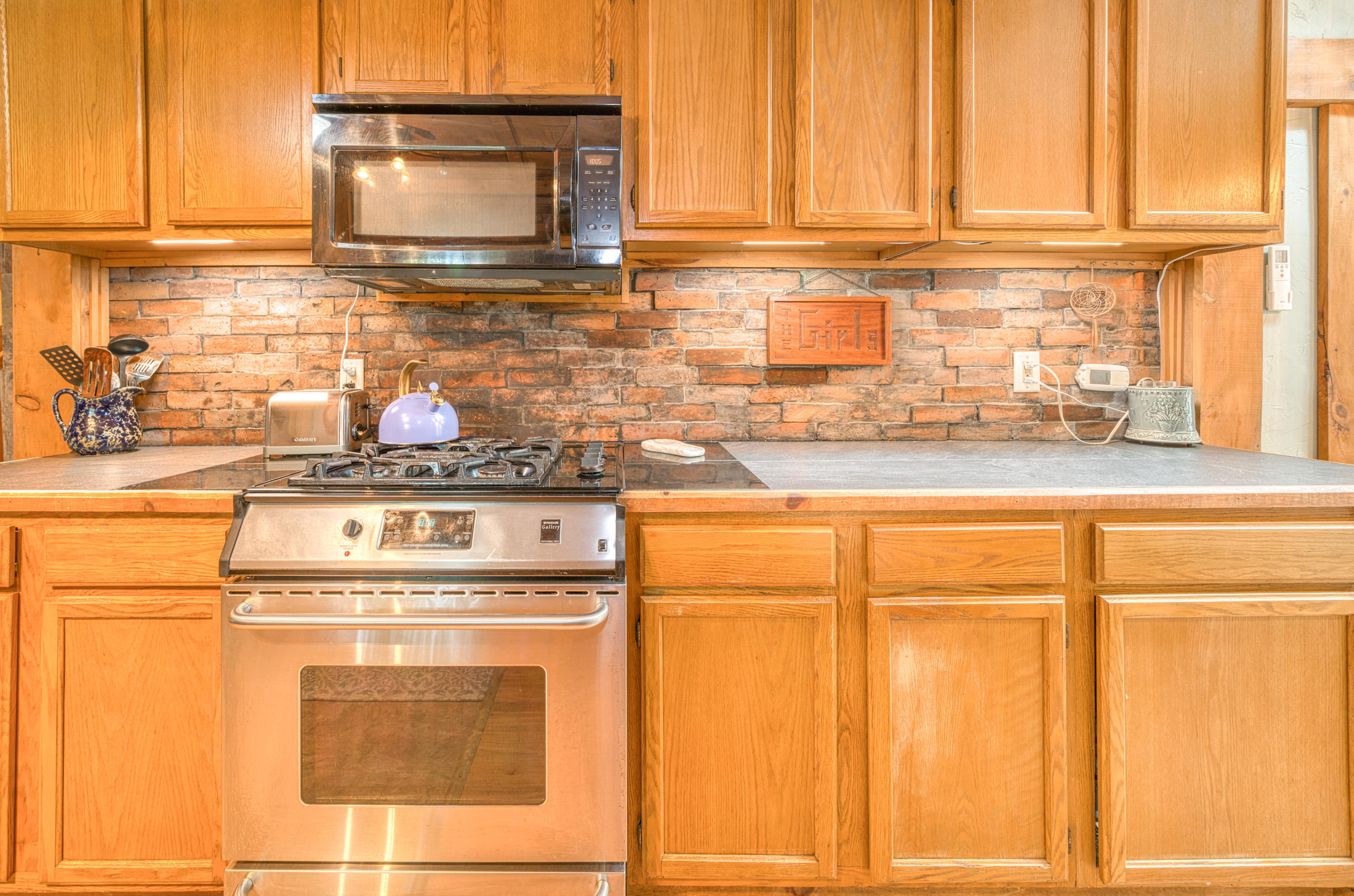 999 Brewer Lake Road Orrington, ME 04474 - Photo 12 of 36 Kitchen stove cabinets and microwave